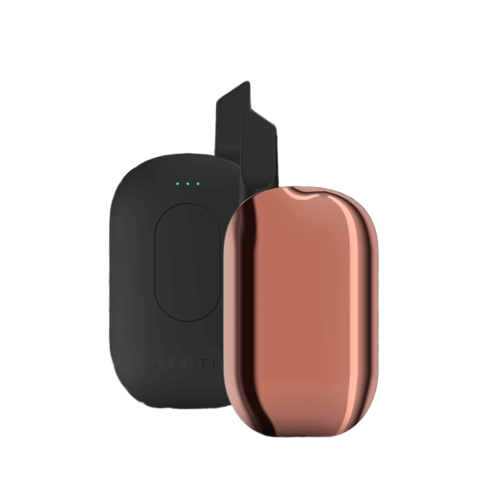 Vessel Compass vape pero v medenej farbe s čiernou nabíjacou stanicou